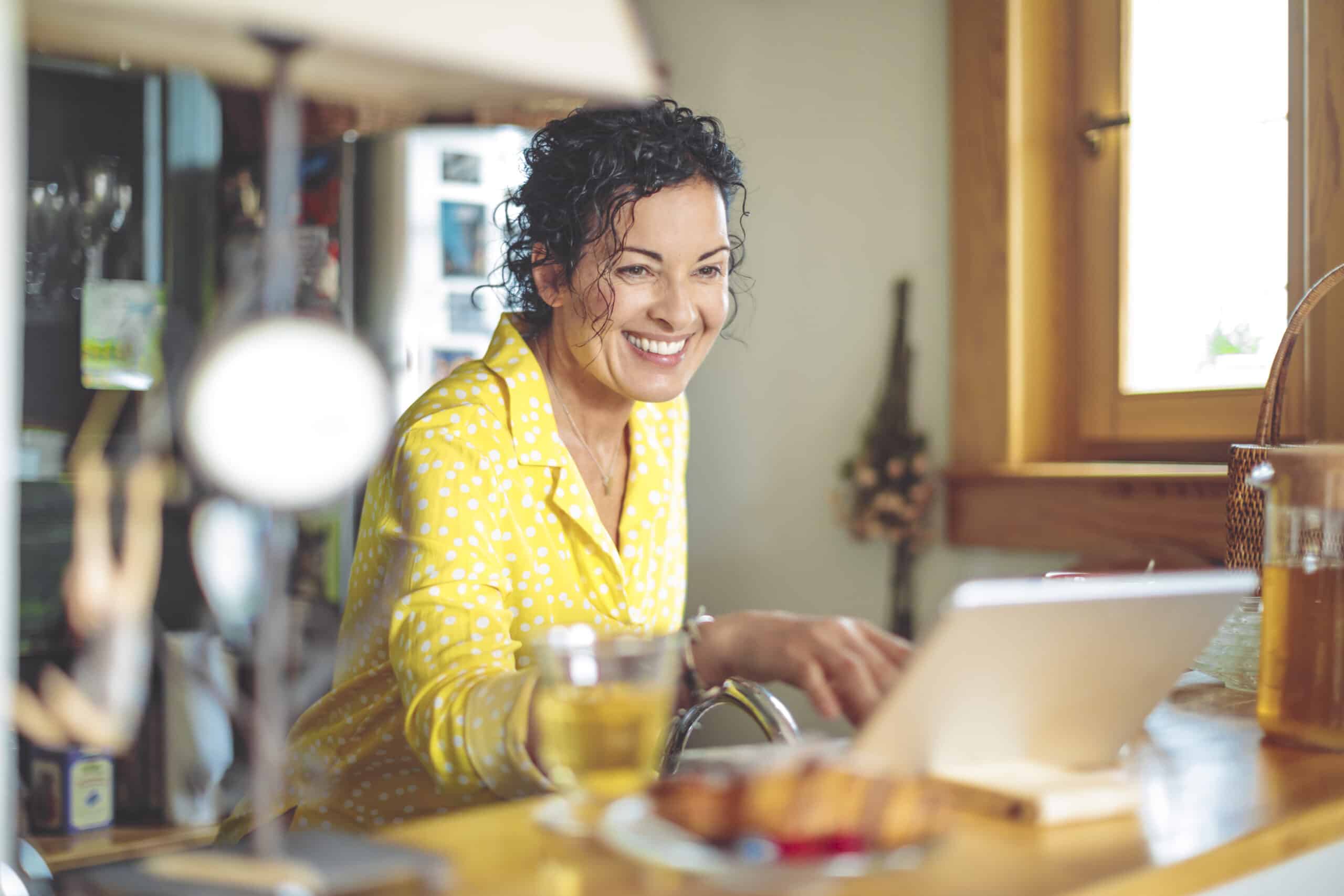 Mature Woman Is Checking Her Finances At Home