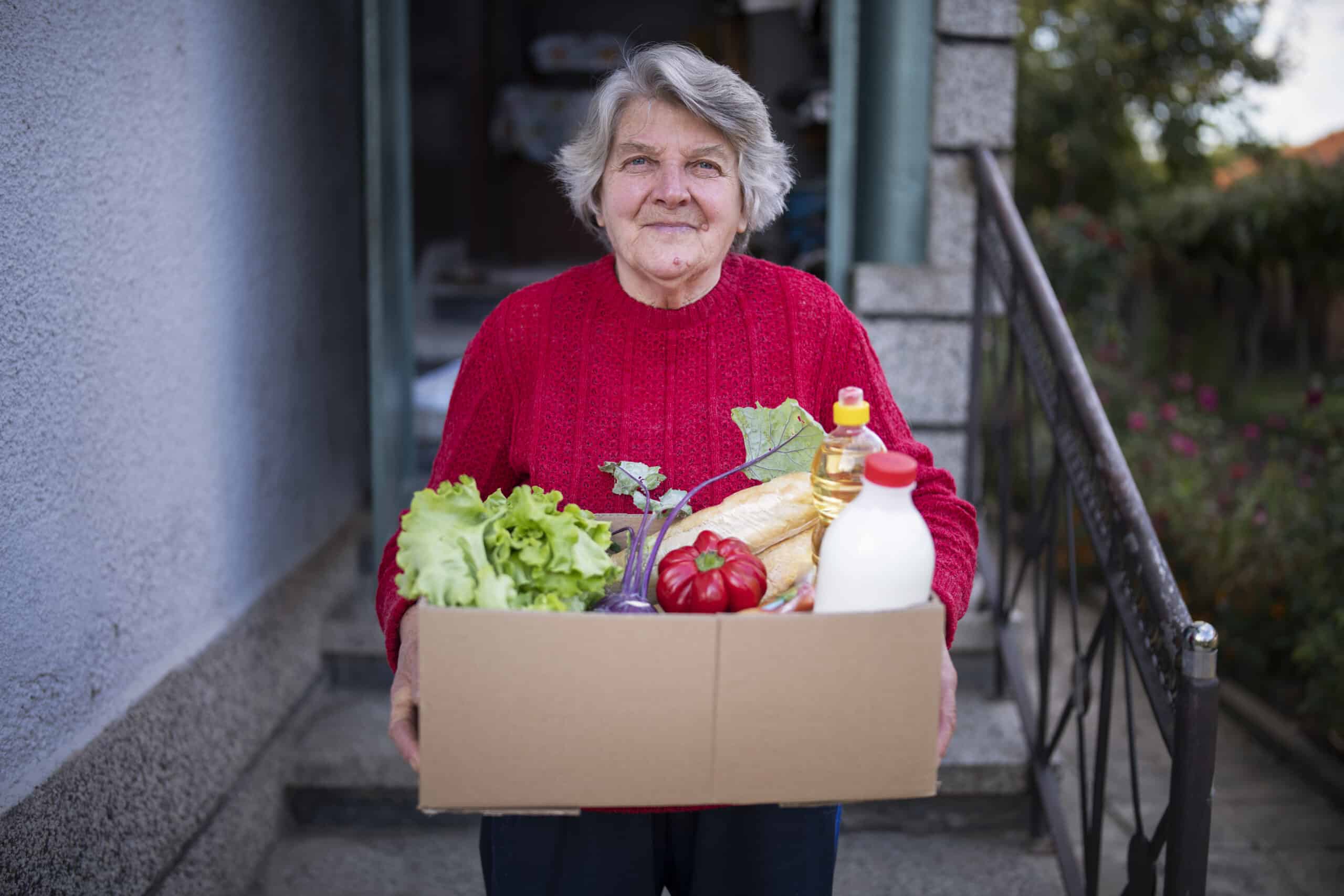 Portrait Of Happy Senior Woman Received Crate With Freshness Food At Home.