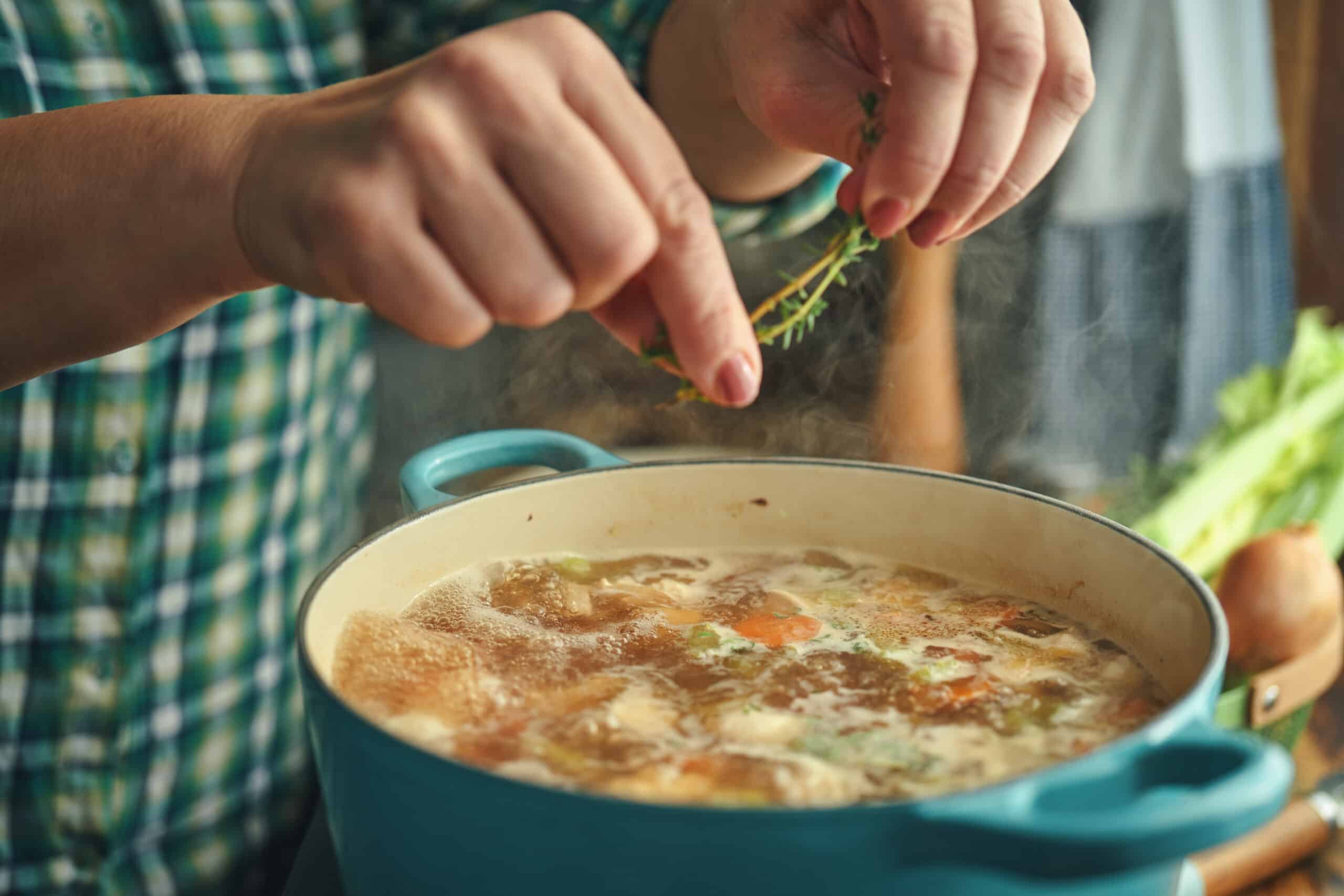 Preparing Chicken Noodles Soup With Fresh Vegetables