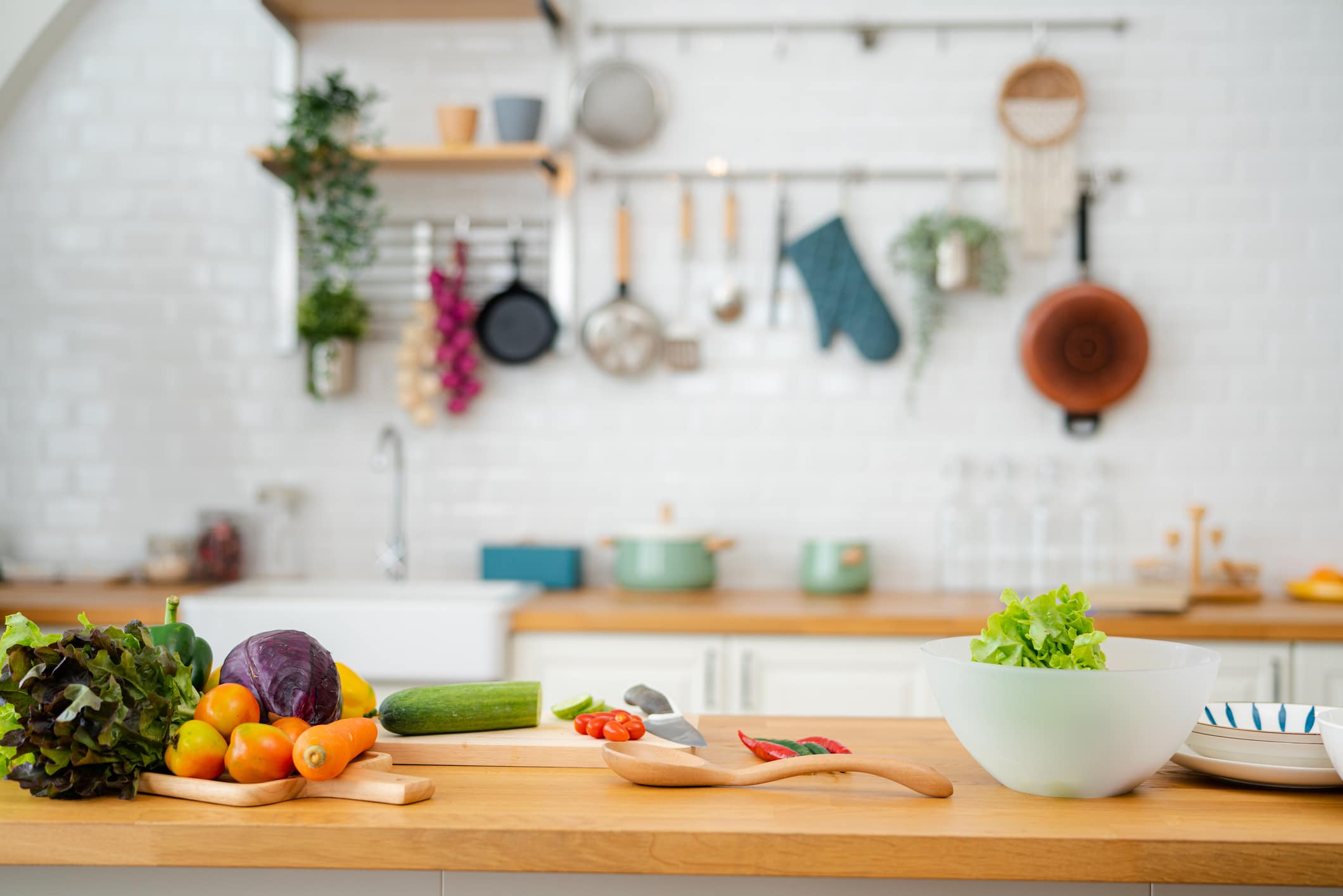 Kitchen Table With Vegetables And Cutting Board For Preparing Salad .