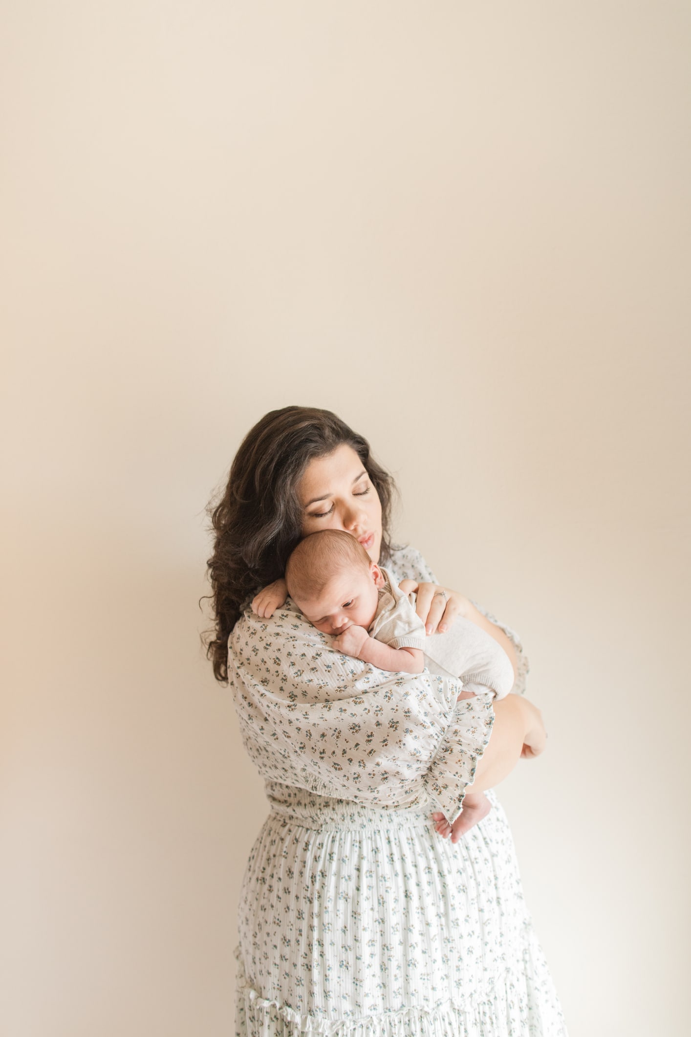30-Year-Old Cuban Mother Embracing Her Newborn Christmas Baby Boy At 3-Weeks Postpartum With Baby Blues