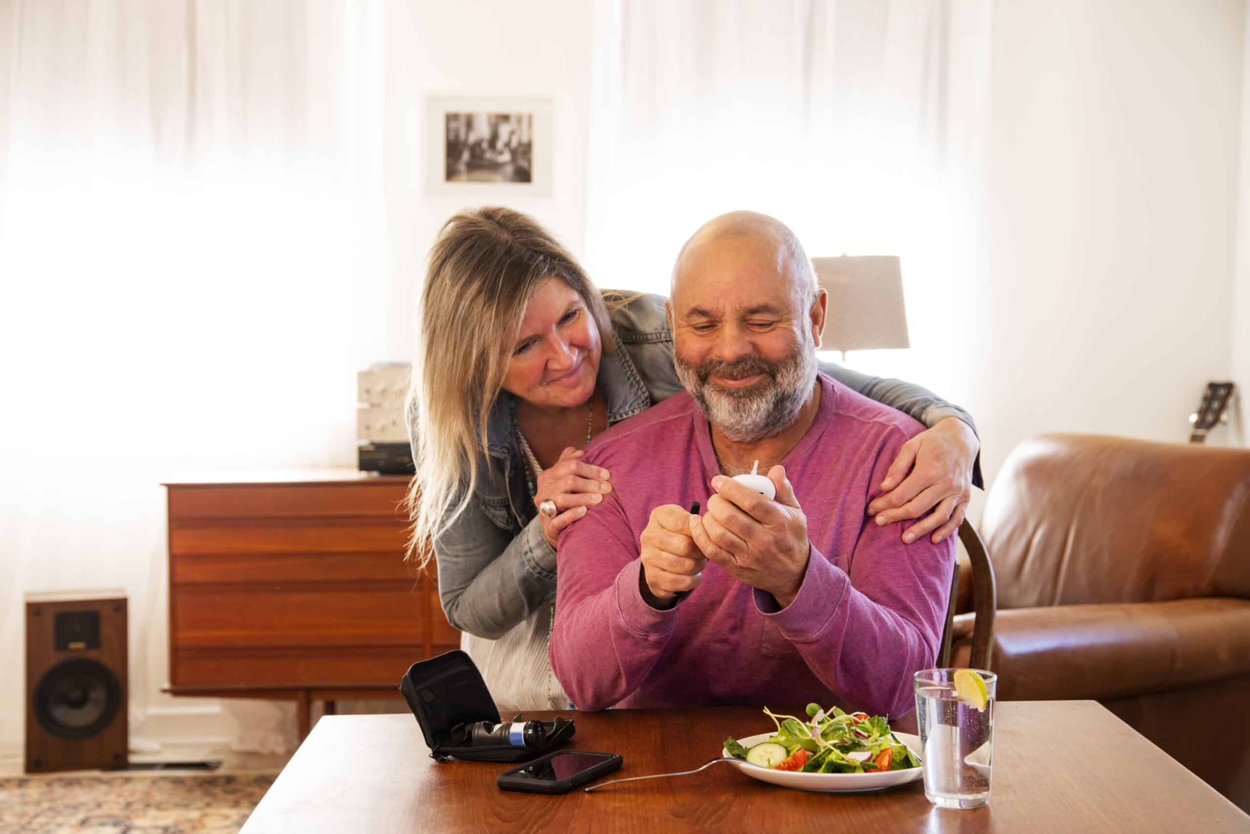 Diabetes Dietitian &Amp; Nutrition 1 Dietitian Group A Diabetic Patient Checking His Blood Sugar At Home With The Support Of His Wife. Consistent Monitoring Of Blood Sugar Is An Important Part Of Managing Diabetes. Photographed In North America