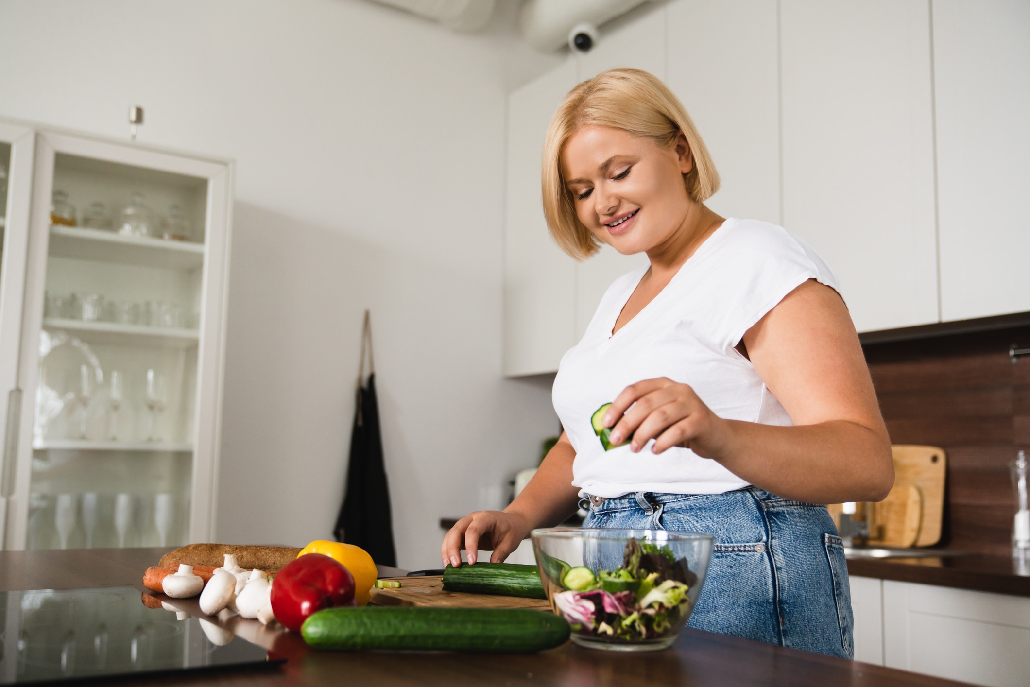 Young Caucasian Plump Plus Size Woman Cooking Making Salad, Healthy Food, Dieting, Counting Calories, Preparing Dinner Lunch At Home Kitchen