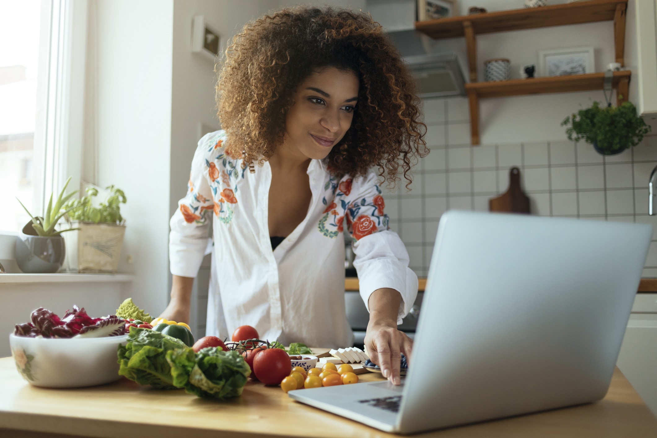 Girl Exploring The Web For Delicious Recipes