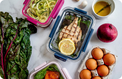 Chicken and kale, along with other vegetables, are locked in different containers, prepped and ready for the week.