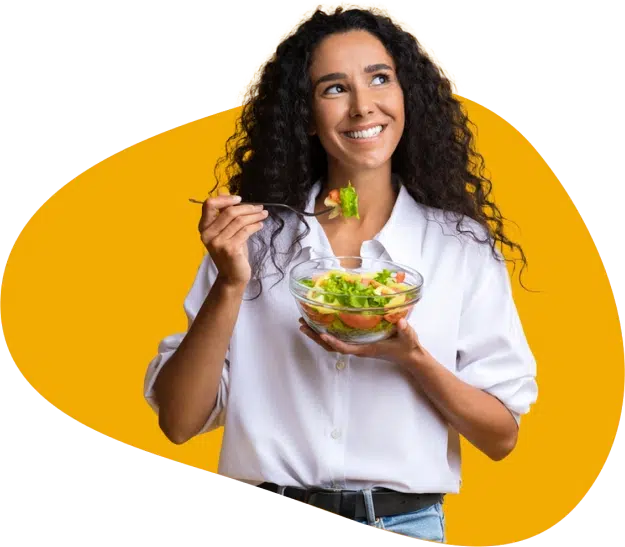 A woman eating salad