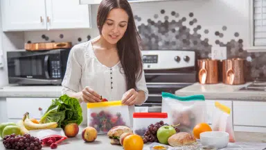 lady organizing fruits in the kitchen