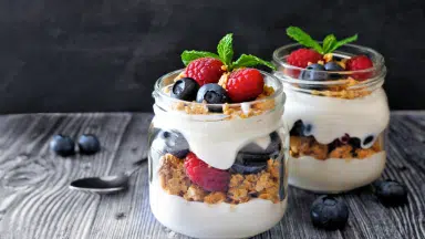 cream with fruits in a jar