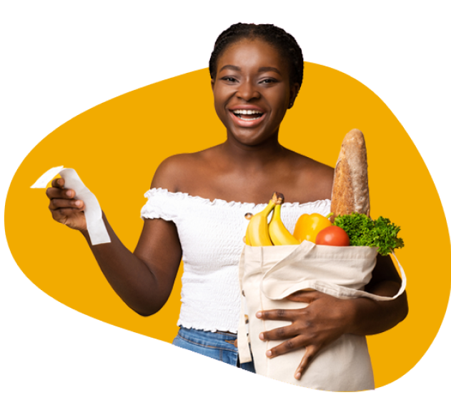 Girl smiling and holding a bag of fresh veggies and fruits