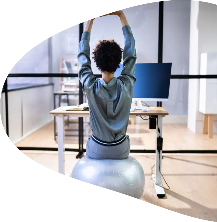 A lady exercising on a yoga ball