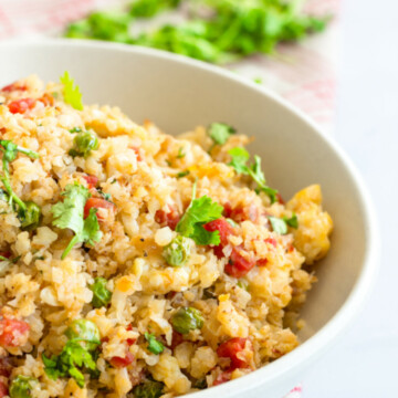 Cauliflower Rice Vertical Photo. Low Carb Cauliflower Stir-Fried Rice in a Bowl.