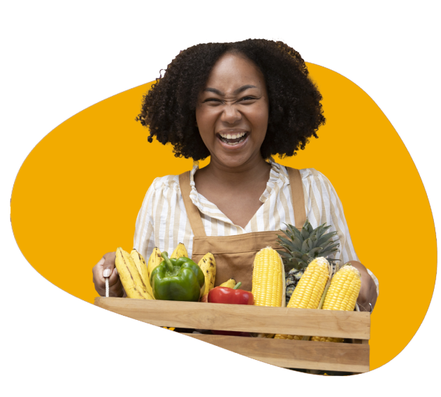 Person holds a basket full of dietitian approved foods such as bananas, bell peppers, corn and pineapple.