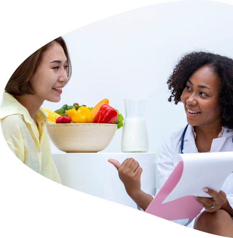 Dietitian looks at a patient as they go over their plan after their counseling session.