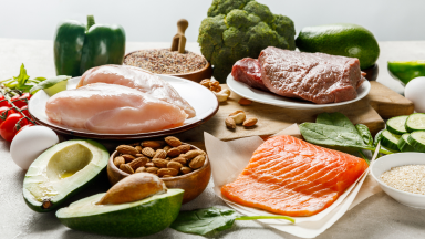 Phosphorus dense foods such as various meat options, shown on a table.