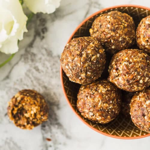 Energy Protein Balls With Healthy Ingredients On Marble Table. Home Made With Dates, Peanut Butter, Flax And Chia Seeds, Oats, Almond And Chocolate Drops