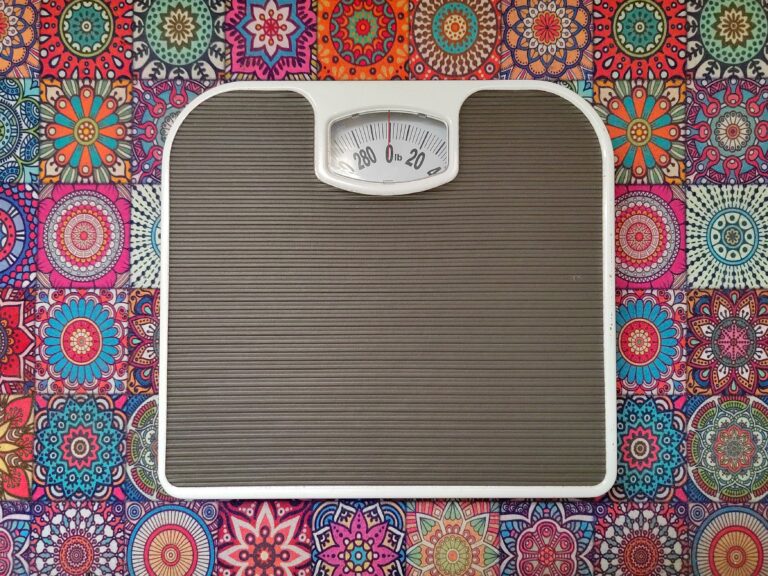 Bathroom Scale On A Colorful Patterned Background.