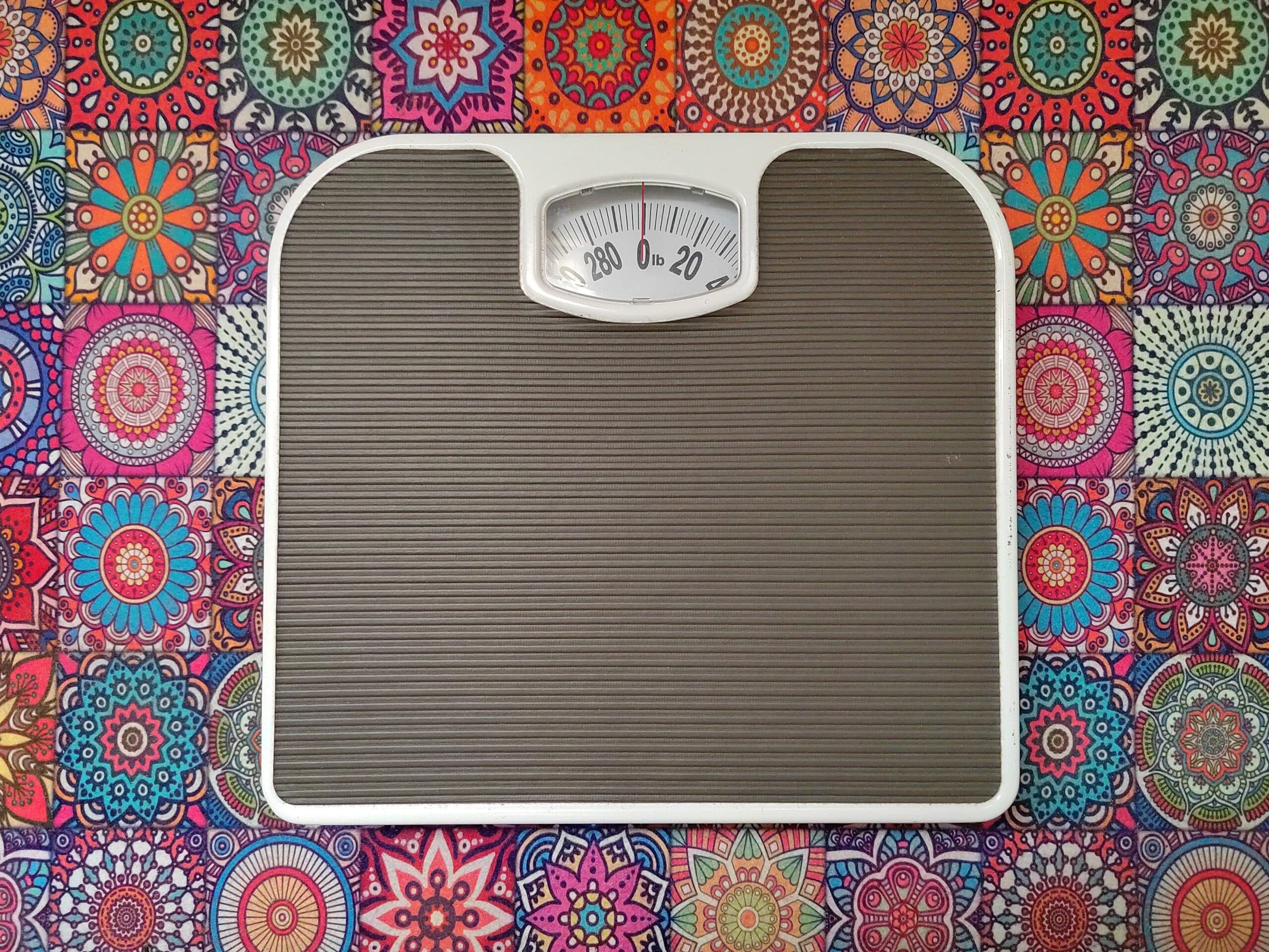 Bathroom Scale On A Colorful Patterned Background.