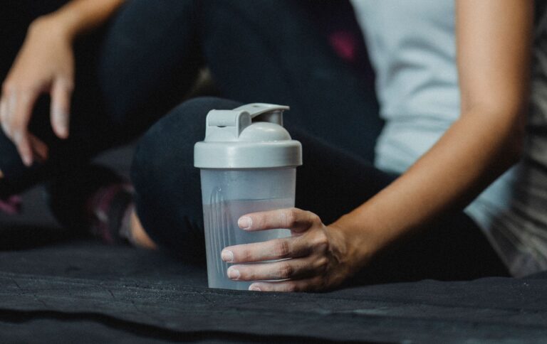 Person Holding A Shaker Bottle Representing Creatine Benefits For Strength And Recovery